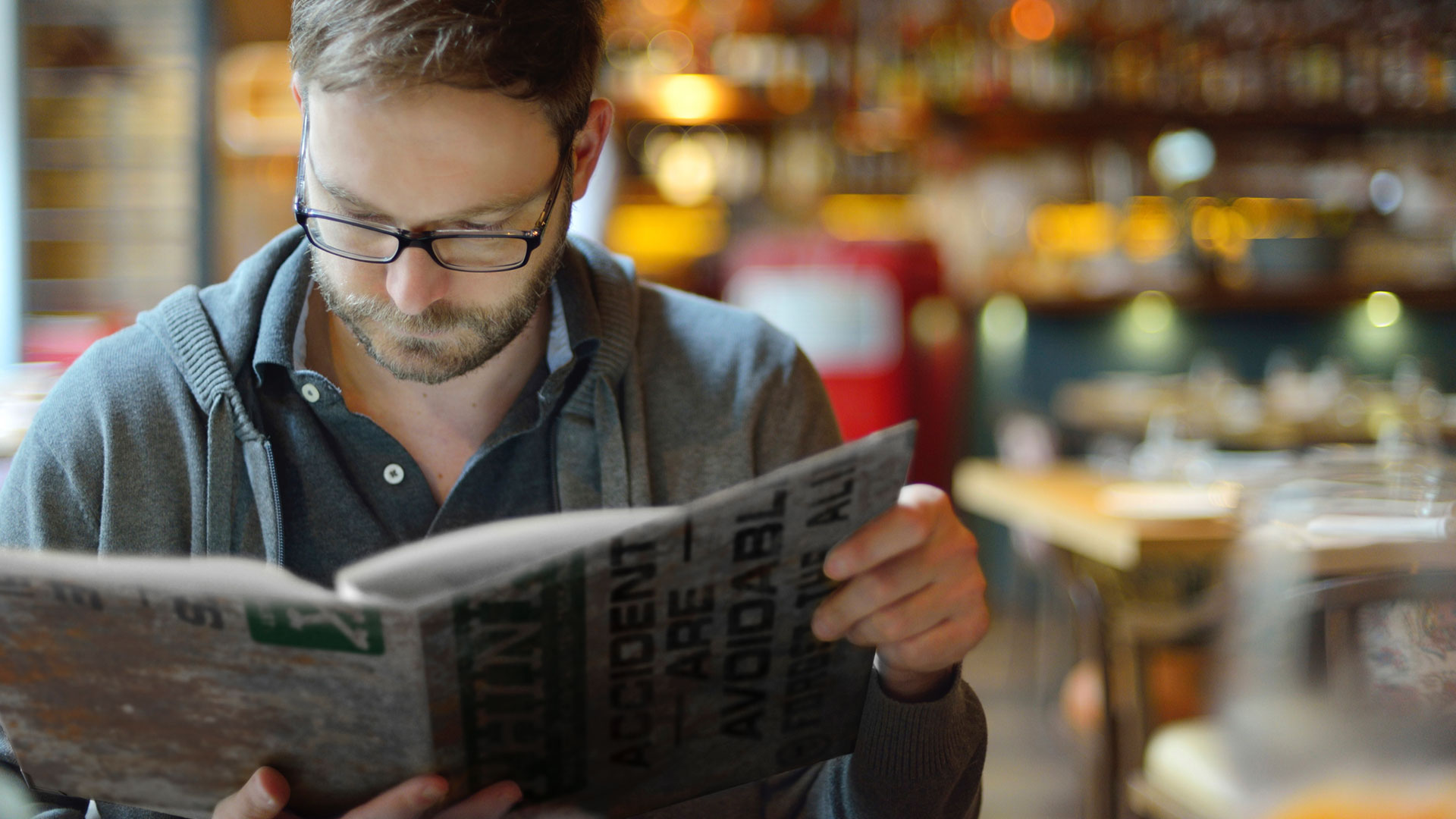 Pig Iron Public House person holding menu