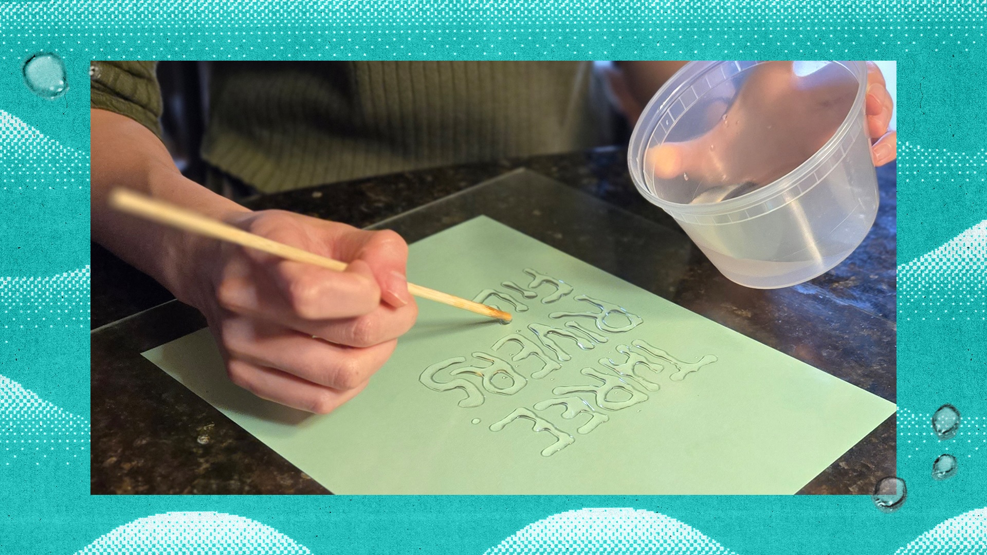 A behind-the-scenes look at the custom lettering for 2025, using water and oil.