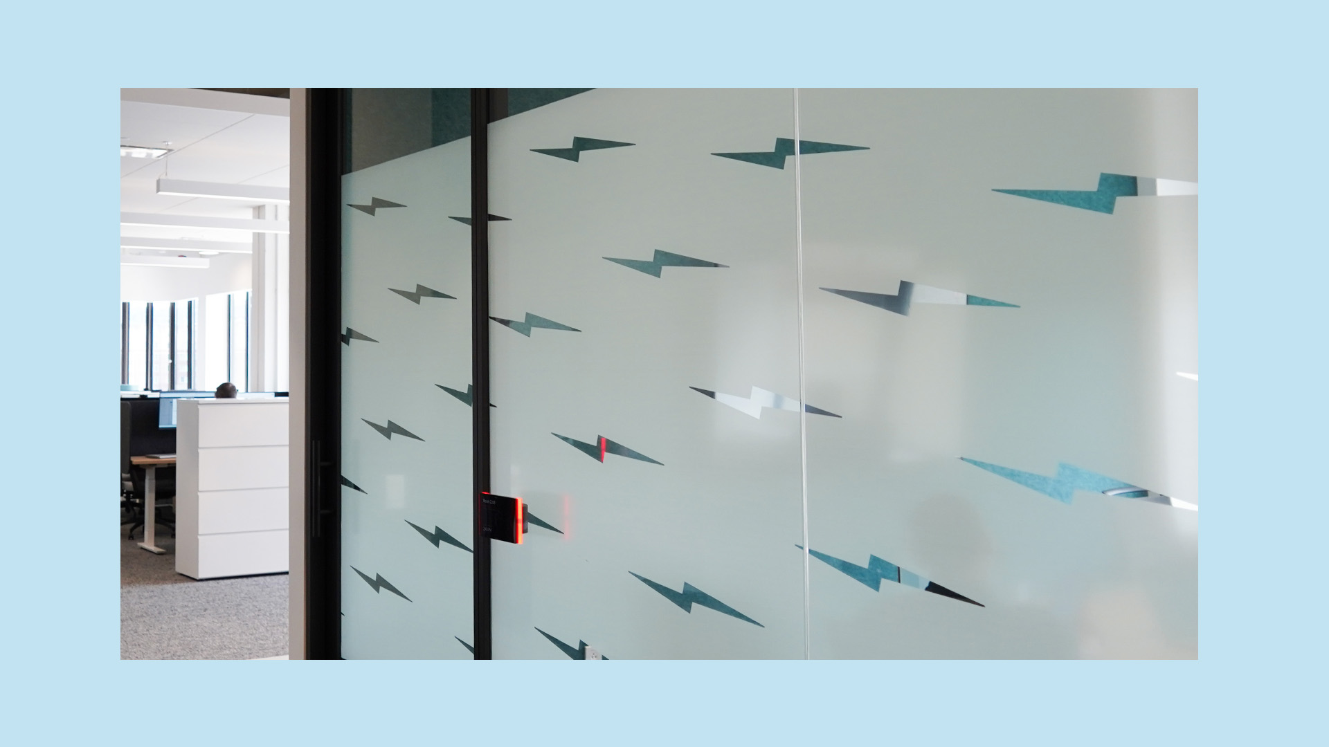 DLC headquarters lightning bolt logo on privacy glass for conference room